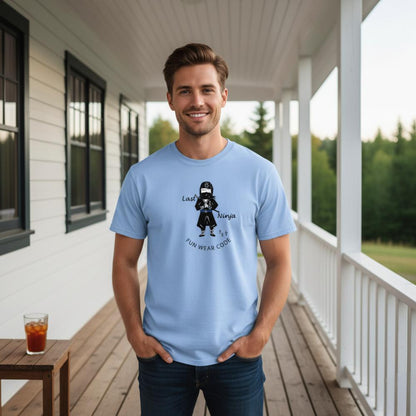 Man wearing a light blue t-shirt with a playful ninja graphic design and text "FUN WEAR CODE" on a porch background