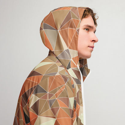 Person wearing a multicolor geometric patterned windbreaker jacket against a plain background