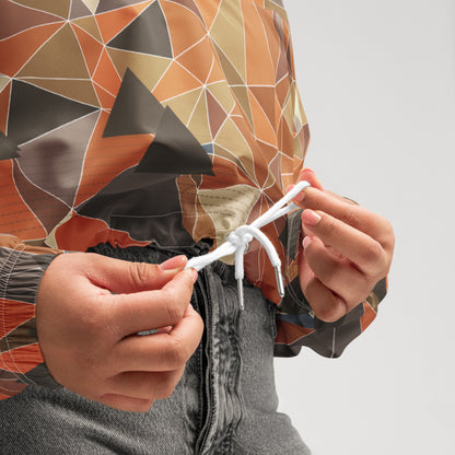 Person tying a knot with a colorful geometric-patterned jacket on a plain background