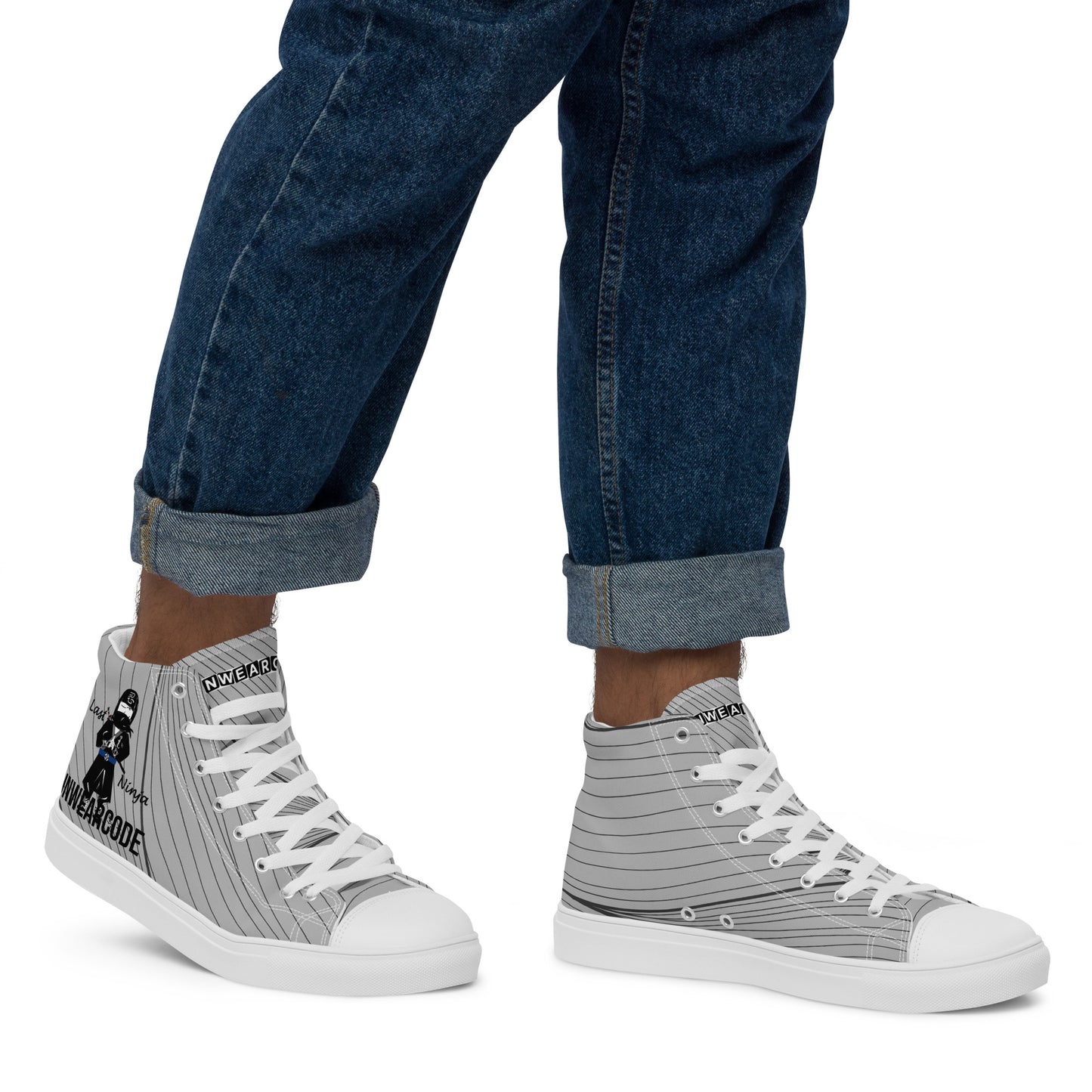 Gray high-top sneakers with white laces and with a ninja graphic and 'Fun Wear Code' text logo, worn with rolled-up blue jeans on a white background